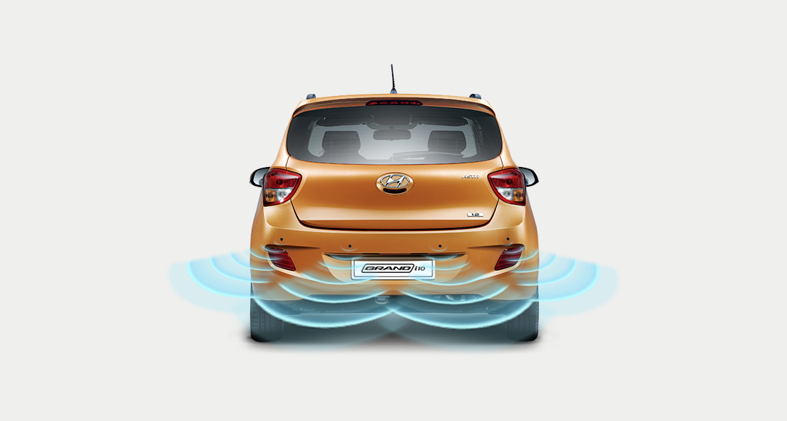 Rear parking assist system sensor illustration on tangerine orange Grand i10